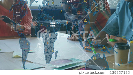 Leaning business professionals sketching on paper at conference table, with map overlay, markers Leaning business professionals sketching on paper at conference table, with map overlay, markers 139257153