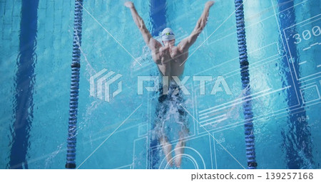 Gliding swimmer in goggles creating splashes in lap pool, with lane dividers and digital overlay Gliding swimmer in goggles creating splashes in lap pool, with lane dividers and digital overlay 139257168