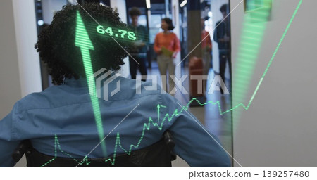 Facing man in wheelchair wearing blue shirt looking down office corridor, with stock chart overlay Facing man in wheelchair wearing blue shirt looking down office corridor, with stock chart overlay 139257480