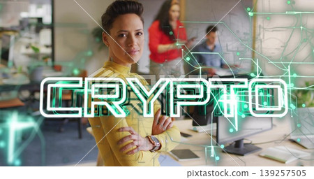 Standing arms crossed mid adult woman in yellow sweater at office desks, CRYPTO overlay, copy space Standing arms crossed mid adult woman in yellow sweater at office desks, CRYPTO overlay, copy space 139257505