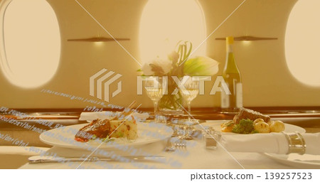 Featuring gourmet plated meals in private jet cabin, with wine, flowers and salt and pepper shakers Featuring gourmet plated meals in private jet cabin, with wine, flowers and salt and pepper shakers 139257523