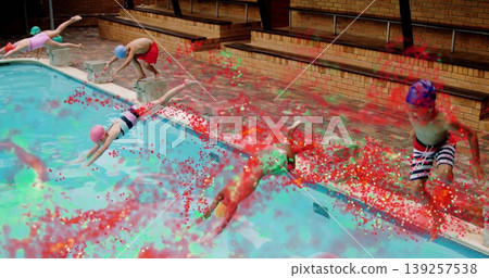 Diving children wearing swim caps and swimsuits launching from blocks at pool deck with splashes Diving children wearing swim caps and swimsuits launching from blocks at pool deck with splashes 139257538