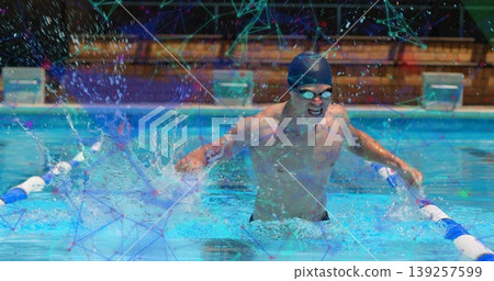 Swimming adult male cutting through clear pool water at competition pool, with lane dividers Swimming adult male cutting through clear pool water at competition pool, with lane dividers 139257599