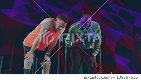 Coaching tracksuit coach guiding athlete on field with whistle smartwatch knee pad floodlight poles Coaching tracksuit coach guiding athlete on field with whistle smartwatch knee pad floodlight poles 139257610
