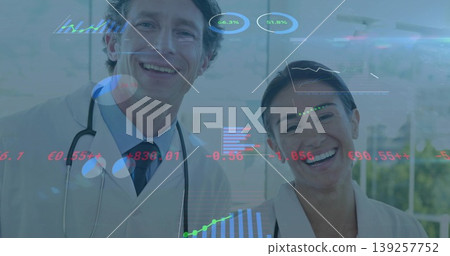 Standing two medical professionals sharing data in facility corridor, with stethoscope overlays Standing two medical professionals sharing data in facility corridor, with stethoscope overlays 139257752