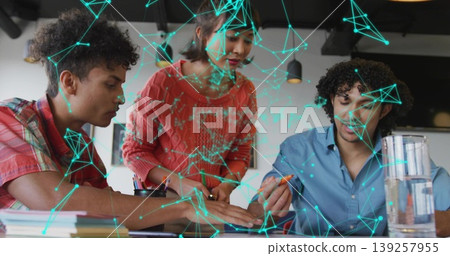 Leaning coworkers marking printed documents on desk in office, colored markers and network overlay Leaning coworkers marking printed documents on desk in office, colored markers and network overlay 139257955