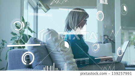 Analyzing senior woman using laptop in living room with sofa, plant, chart overlays, copy space Analyzing senior woman using laptop in living room with sofa, plant, chart overlays, copy space 139257991