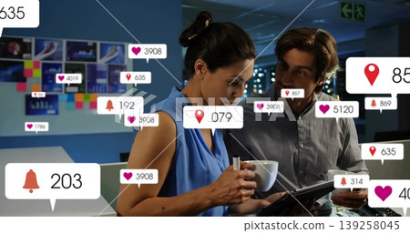 Colleagues wearing blue top, gray shirt reviewing tablet data at control room, with metric overlays Colleagues wearing blue top, gray shirt reviewing tablet data at control room, with metric overlays 139258045