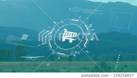 Overlaying circular HUD showing shopping cart icon over grass runway valley, with taxiing airplane Overlaying circular HUD showing shopping cart icon over grass runway valley, with taxiing airplane 139258057