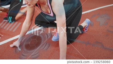 Crouching front sprinter placing hands on starting blocks and line at red track, with HUD overlays Crouching front sprinter placing hands on starting blocks and line at red track, with HUD overlays 139258060