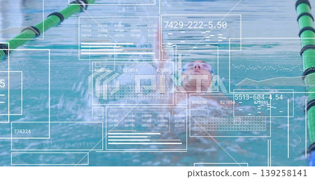 Gliding swimmer wearing cap, goggles performing backstroke in pool lane, with digital data overlays Gliding swimmer wearing cap, goggles performing backstroke in pool lane, with digital data overlays 139258141