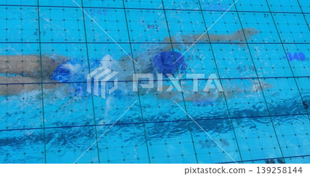 Swimming female athlete propelling in pool water, with swim cap, swimsuit, grid and numeric data 139258144