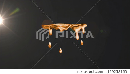 Floating molten gold-like ribbon under bright lens flare in black studio, with falling droplets Floating molten gold-like ribbon under bright lens flare in black studio, with falling droplets 139258163