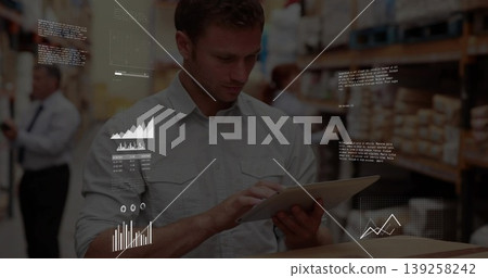 Checking tablet supervisor wearing grey shirt scanning boxes in warehouse aisle, floating charts 139258242