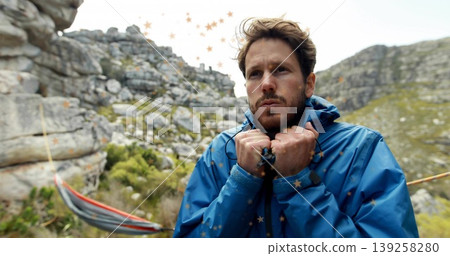 Bracing man gripping blue jacket collar on rocky hillside, with striped hammock rope and boulders Bracing man gripping blue jacket collar on rocky hillside, with striped hammock rope and boulders 139258280