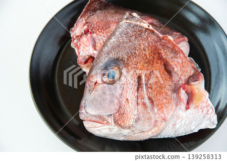 A sea bream head on a plate A sea bream head on a plate 139258313