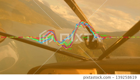 Displaying waveform graph across windshield in cockpit, with numeric labels over lake and mountains Displaying waveform graph across windshield in cockpit, with numeric labels over lake and mountains 139258619