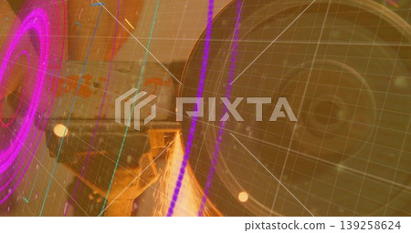 Rotating grinder wheel generating sparks on workpiece in shop, with neon HUD overlay, copy space Rotating grinder wheel generating sparks on workpiece in shop, with neon HUD overlay, copy space 139258624