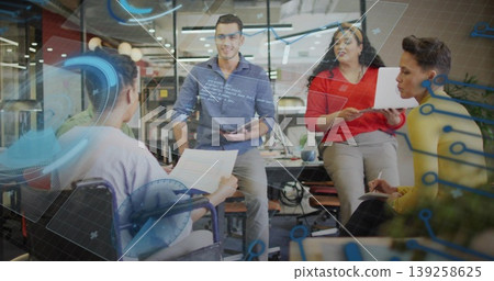 Collaborating four professionals discussing project in office with glass interface and wheelchair Collaborating four professionals discussing project in office with glass interface and wheelchair 139258625