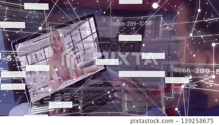 Holding laptop on lap, man in dark shirt connecting with pink-top woman in office, code overlays Holding laptop on lap, man in dark shirt connecting with pink-top woman in office, code overlays 139258675