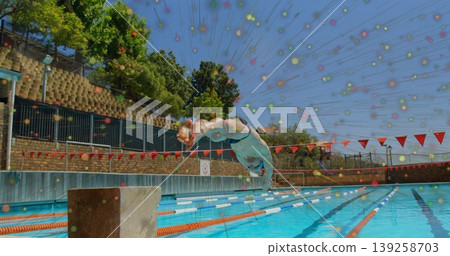 Diving male athlete wearing swim briefs plunging off block at outdoor pool with digital overlay Diving male athlete wearing swim briefs plunging off block at outdoor pool with digital overlay 139258703