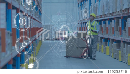 Worker wearing vest reviewing inventory on tablet by pallet jack in warehouse, AR icons, copy space 139258746