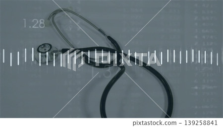Resting black stethoscope lying on bluish surface, showing white waveform and data grid Resting black stethoscope lying on bluish surface, showing white waveform and data grid 139258841