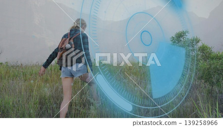 Hiking woman climbing grassy slope in mountain valley with backpack, boots, HUD overlay, copy space Hiking woman climbing grassy slope in mountain valley with backpack, boots, HUD overlay, copy space 139258966