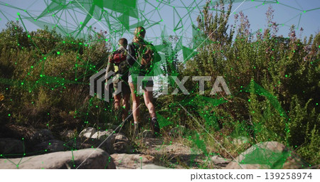 Climbing two hikers ascending rocky hillside trail under blue sky, with backpacks, network overlay Climbing two hikers ascending rocky hillside trail under blue sky, with backpacks, network overlay 139258974