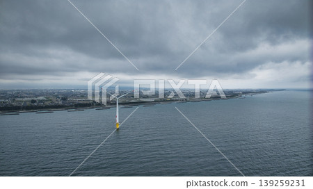 A view of the Sasagawa district and offshore wind turbines from Shimonikawa Beach in Nyuzen Town, Toyama Prefecture, during bad weather at the end of April. A view of the Sasagawa district and offshore wind turbines from Shimonikawa Beach in Nyuzen Town, Toyama Prefecture, during bad weather at the end of April. 139259231
