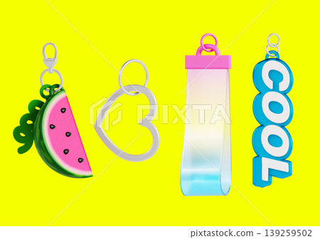 Four keychains are arranged on a bright yellow background. One keychain is a watermelon slice, another is a heart shape, then a transparent strip, and lastly one says COOL. Four keychains are arranged on a bright yellow background. One keychain is a watermelon slice, another is a heart shape, then a transparent strip, and lastly one says COOL. 139259502