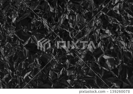 Shiny black grey foil metal texture, abstract wrapping paper for background and design art work. 139260078