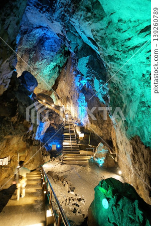 The mystical underground space of Nippara Limestone Cave, illuminated by fantastical blue lights. The mystical underground space of Nippara Limestone Cave, illuminated by fantastical blue lights. 139260789