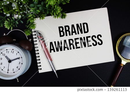 Brand Awareness text with alarm clock and magnifying glass Brand Awareness text with alarm clock and magnifying glass 139261113