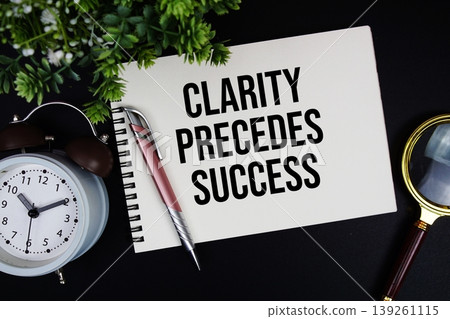 Clarity Precedes Success text with alarm clock and magnifying glass Clarity Precedes Success text with alarm clock and magnifying glass 139261115