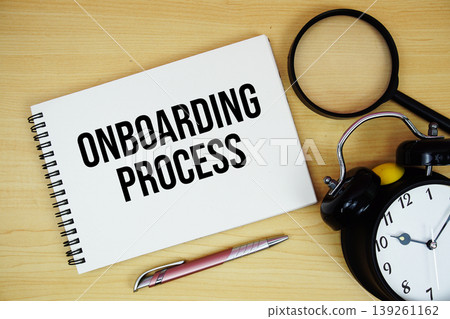 Onboarding Process text written on notepad with alarm clock and magnifying glass flat lay on wooden background Onboarding Process text written on notepad with alarm clock and magnifying glass flat lay on wooden background 139261162