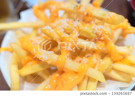 French fries with cheese sauce 139261687