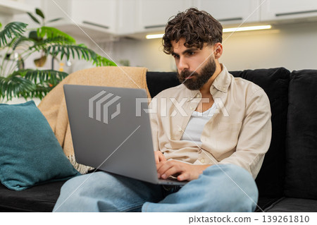 Indian man freelance laptop user typing focused planning ideas for future project remote job success Indian man freelance laptop user typing focused planning ideas for future project remote job success 139261810