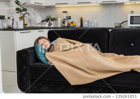 Young woman collapses on pillow after long work shift stressed and tired eyes close and falls asleep Young woman collapses on pillow after long work shift stressed and tired eyes close and falls asleep 139261853