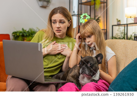 Mother daughter dog lose contest or game on laptop sigh feel sad support each other hug family care 139261930