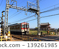 A Kintetsu Nara Line train runs in front of the reconstructed Suzaku Gate at the Nara Heijo Palace Site, a World Heritage Site. 139261985