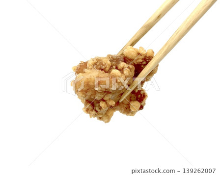 Image of freshly fried chicken; pick up one piece with chopsticks. Image of freshly fried chicken; pick up one piece with chopsticks. 139262007