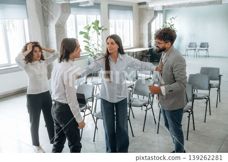 Disagreement, ready to fight. Group of people are working in the office together as a team Disagreement, ready to fight. Group of people are working in the office together as a team 139262281