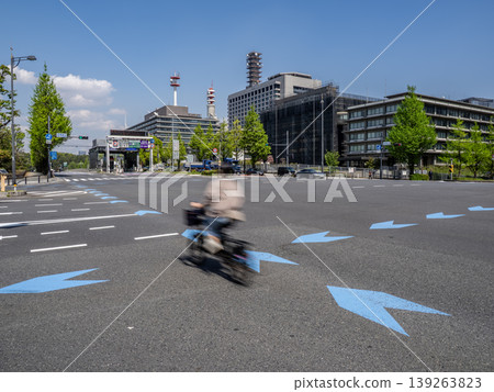 A bicycle riding on the bicycle navigation line in an intersection. A bicycle riding on the bicycle navigation line in an intersection. 139263823