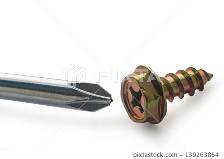Construction screw and screwdriver on white isolated background 139263864