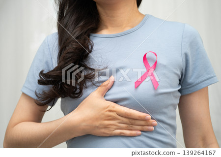 Asian woman with pink ribbon, World Breast Cancer Day at October. Asian woman with pink ribbon, World Breast Cancer Day at October. 139264167