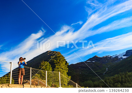 Tourist taking photo in norwegian nature Tourist taking photo in norwegian nature 139264230