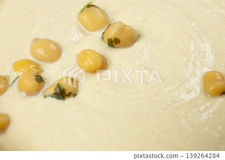 Macro texture of smooth creamy hummus top view Macro texture of smooth creamy hummus top view 139264284