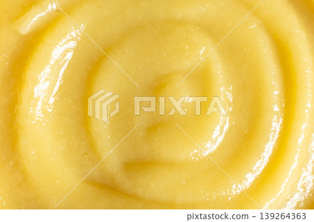 Abstract yellow fruit sauce background with swirl pattern. Abstract yellow fruit sauce background with swirl pattern. 139264363