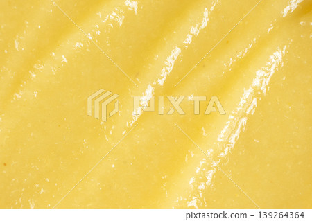 Close-up of creamy mashed apple sauce texture. Close-up of creamy mashed apple sauce texture. 139264364